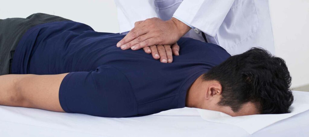 chiropractor helping patient with multiple sclerosis