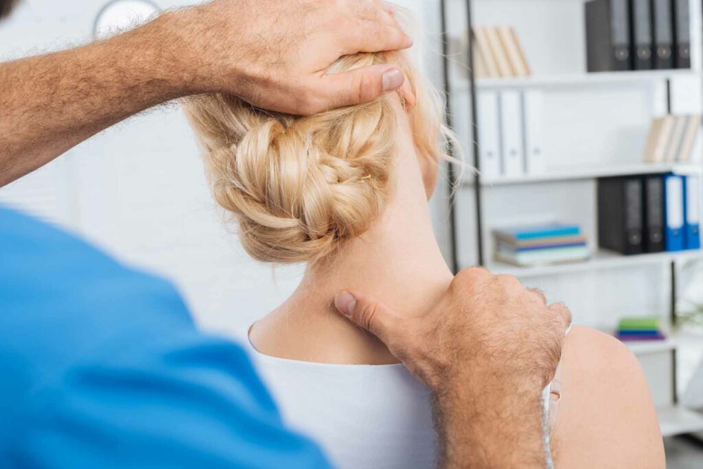 chiropractor stretching upper back