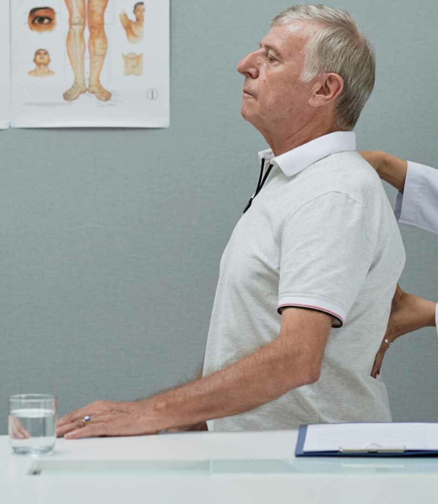 Chiropractor checking upper back